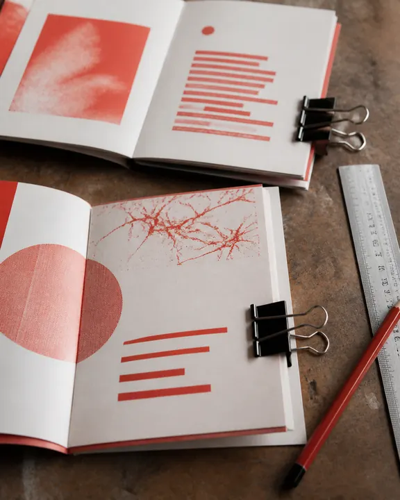 Zine proofs on a worktable